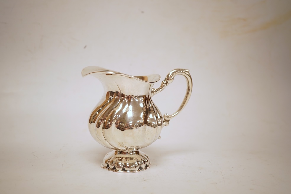 A 20th century Hungarian 800 standard white metal pedestal milk jug, post 1937 mark, height 10.6cm, 7.4oz.